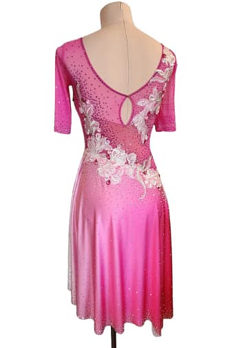 Gia Latin dress - front view - showcasing pink fabric with intricate silver floral appliqué and rhinestone embellishments.