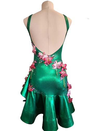 Orchid Latin dress – front view - emerald green satin with pink 3D floral appliqués, crystal detailing, and an asymmetrical ruffled skirt.