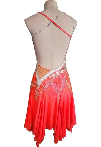 Sola Latin dress — front view — orange asymmetrical dress with silver and nude mesh panels and crystal detailing