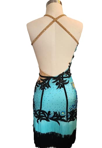 Jayla Latin dress — back view — open back with gold beaded criss-cross straps and black appliqué design.