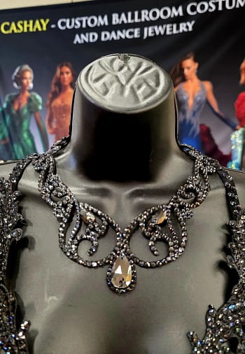 Close-up of black crystal ballroom necklace highlighting graphite stones and high-shine faceted finish