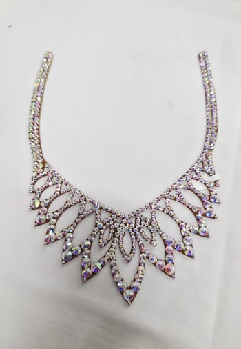 Full flat lay of crystal ballroom necklace with elegant openwork design