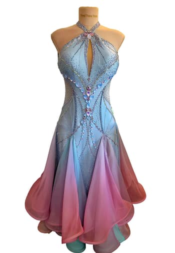Ballroom gown front view on mannequin featuring light blue halter neckline, crystal embellishments, and flowing ombré chiffon skirt in blue and pink tones.
