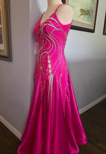 Side view of Malibu Dream ballroom gown showing fitted silhouette and flowing pink skirt