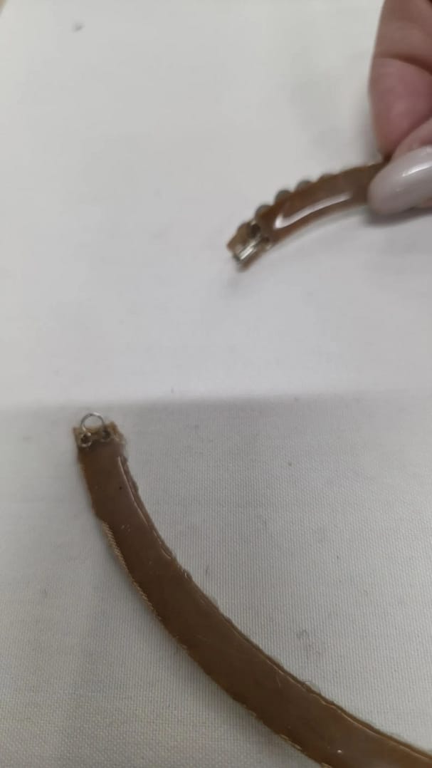 Back view of ballroom necklace showing silicone backing and secure clasp