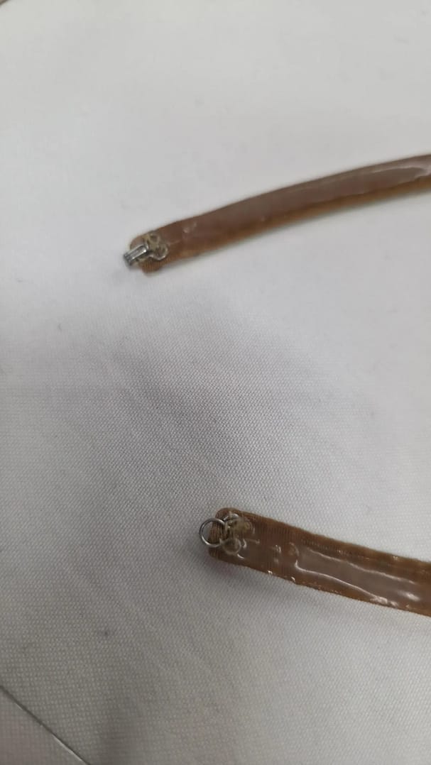 Back construction of ballroom necklace showing silicone backing for secure fit