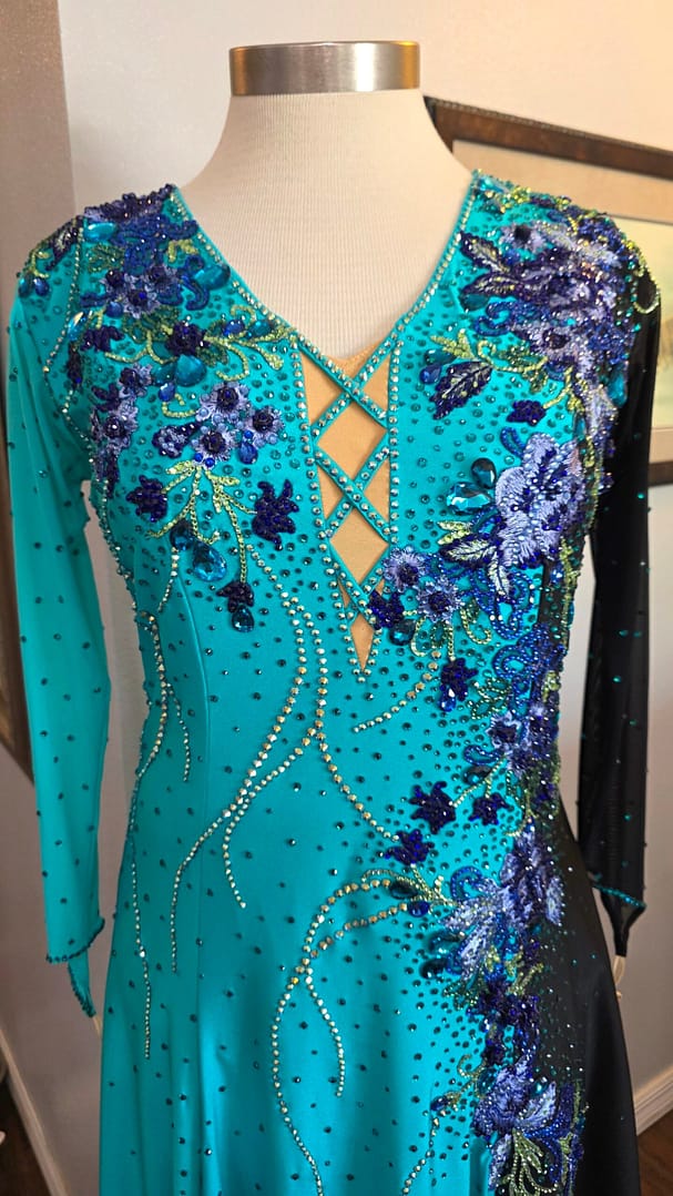 Electric Bloom ballroom dress bodice detail with blue floral appliqué and rhinestone crystals