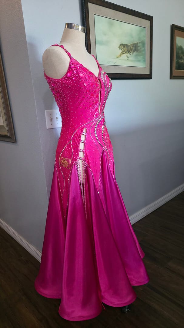 Side view of Malibu Dream ballroom gown showing fitted silhouette and flowing pink skirt