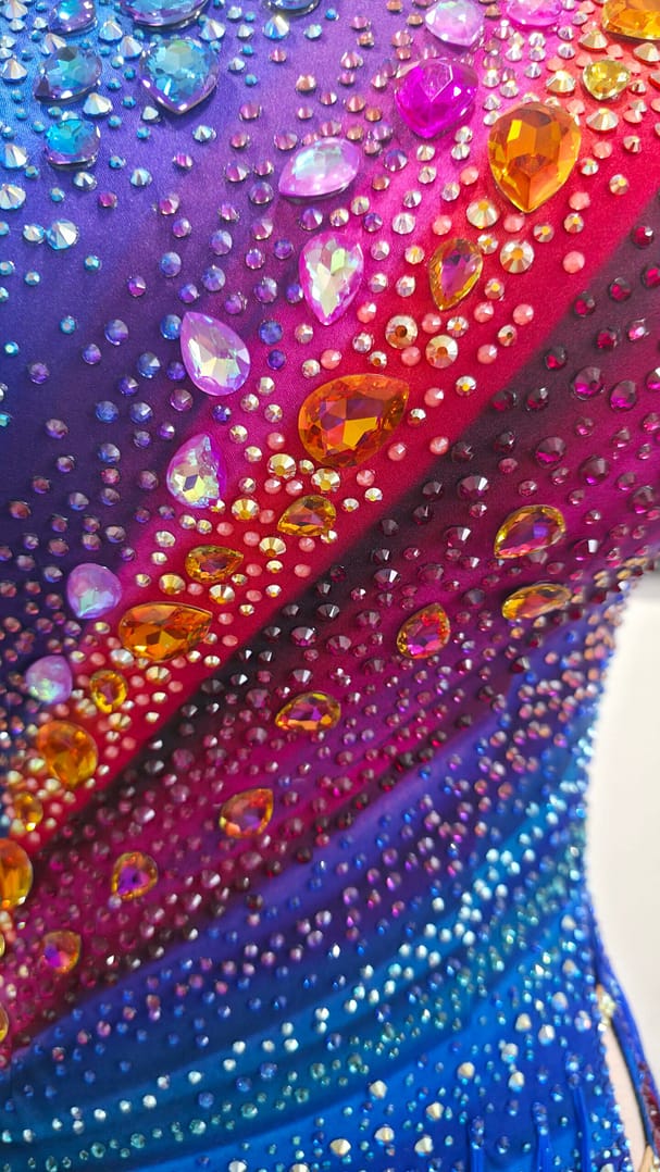 Chromatic Fire Latin dress close-up of colorful crystals and rhinestone embellishments