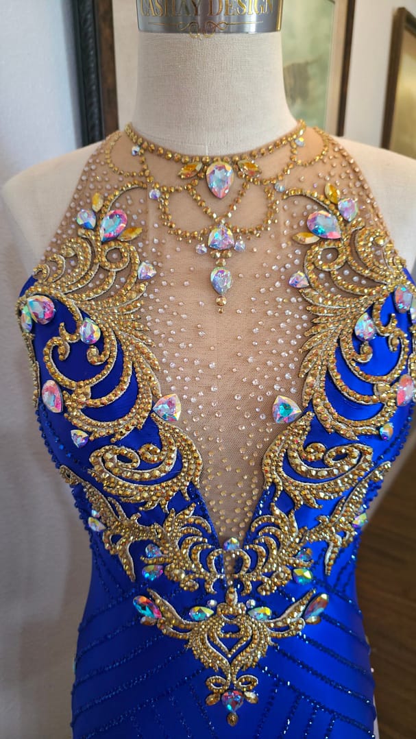 Royal Aurum Dress neckline detail with ornate gold crystal design and illusion mesh plung