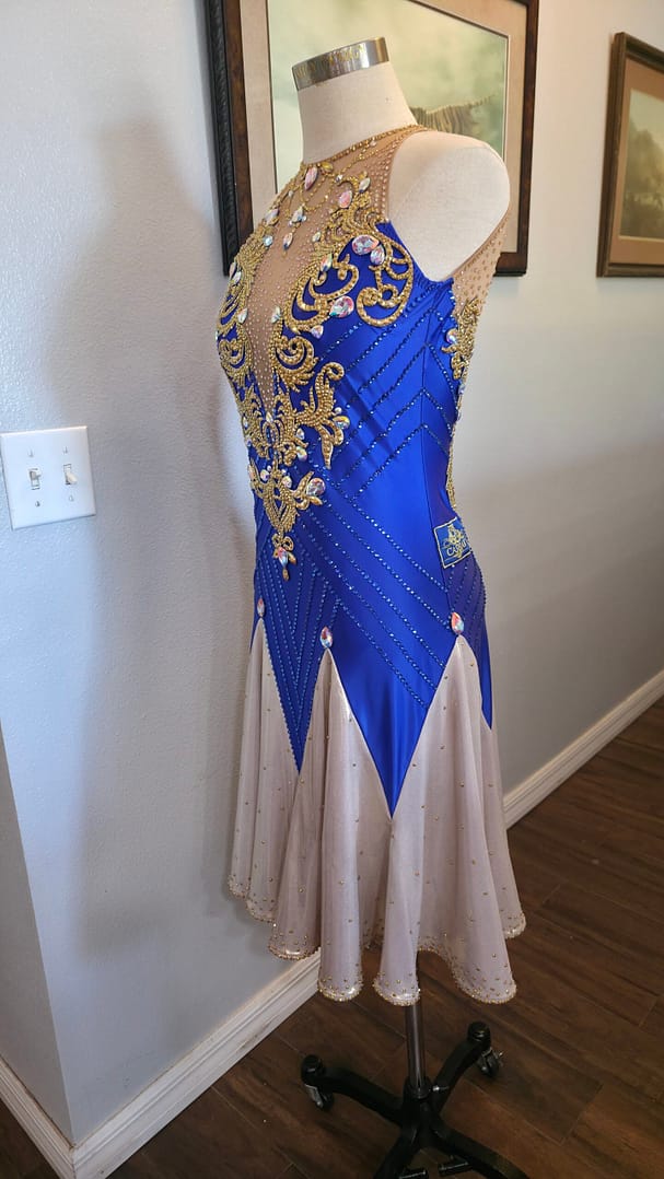 Royal Aurum Dress side view highlighting fitted silhouette with crystal lines and gold embellishments