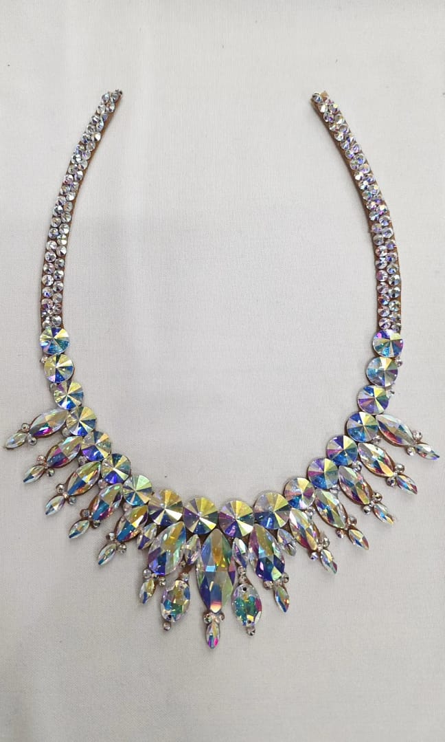 Full flat lay of large stones ballroom necklace showing symmetrical oversized crystal AB stone arrangement