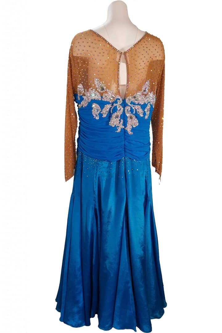 Paz Ballroom Dress – Back View — royal-blue ballroom gown with nude mesh back, keyhole opening, and crystal-covered appliques across the bodice.