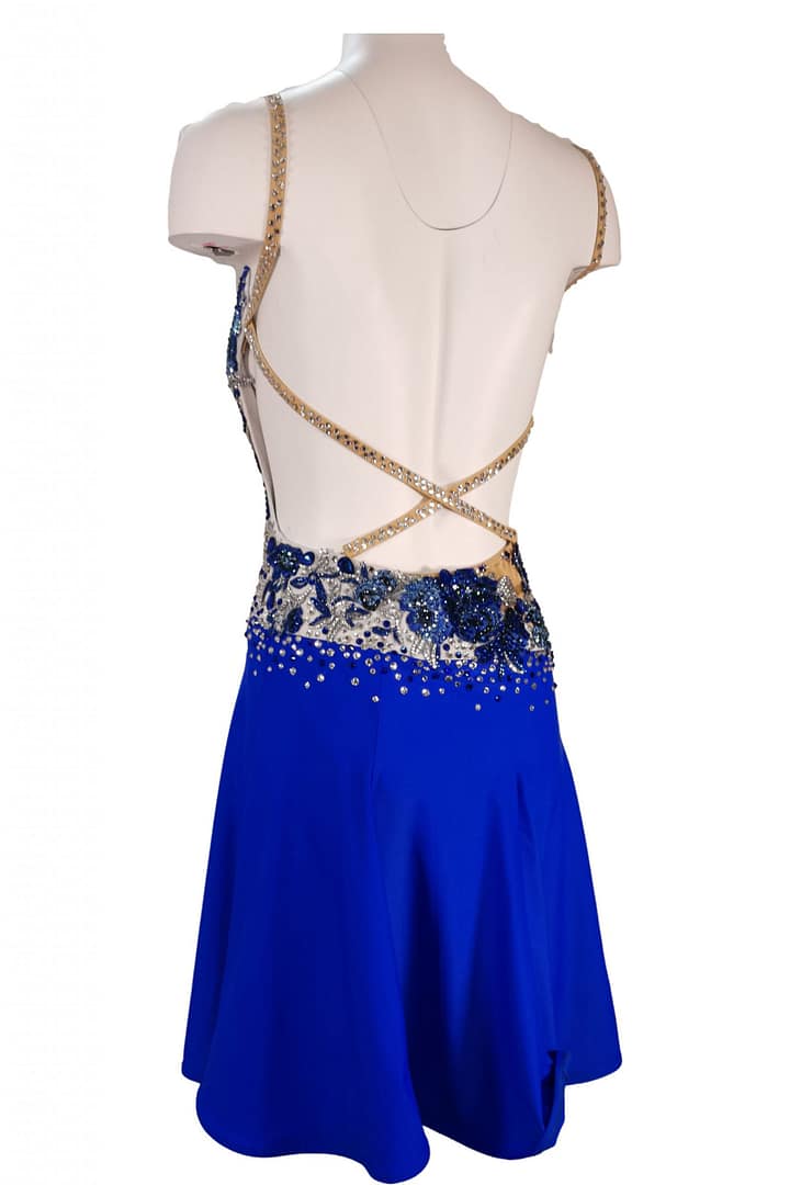 Manon Latin dress — back view — open back with thin crystal crisscross straps and blue appliqué accents
