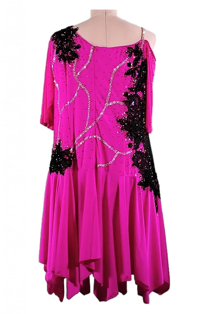 Edra Latin dress — back view — magenta with black lace appliqué, crystal detailing, and an off-shoulder sleeve