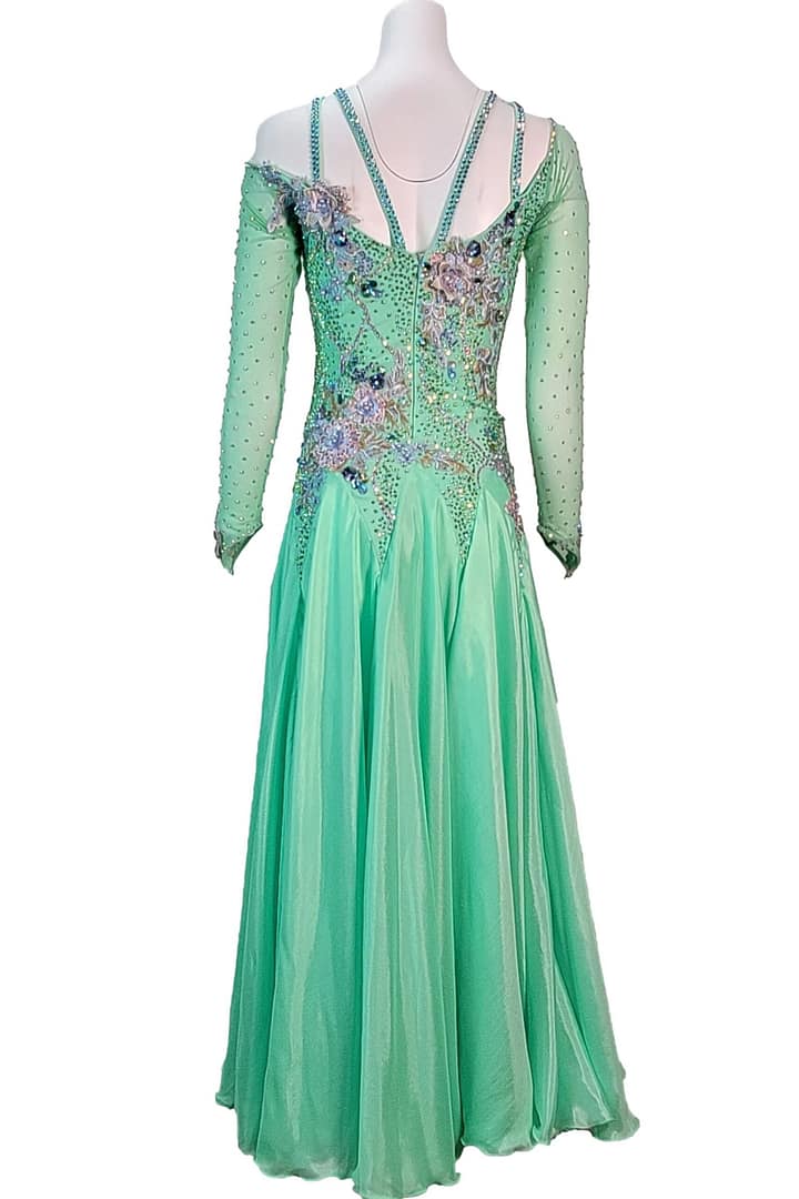 Rain ballroom dress — back view — full-length, light green gown with an open V-back and shoulder straps made of crystal chains.