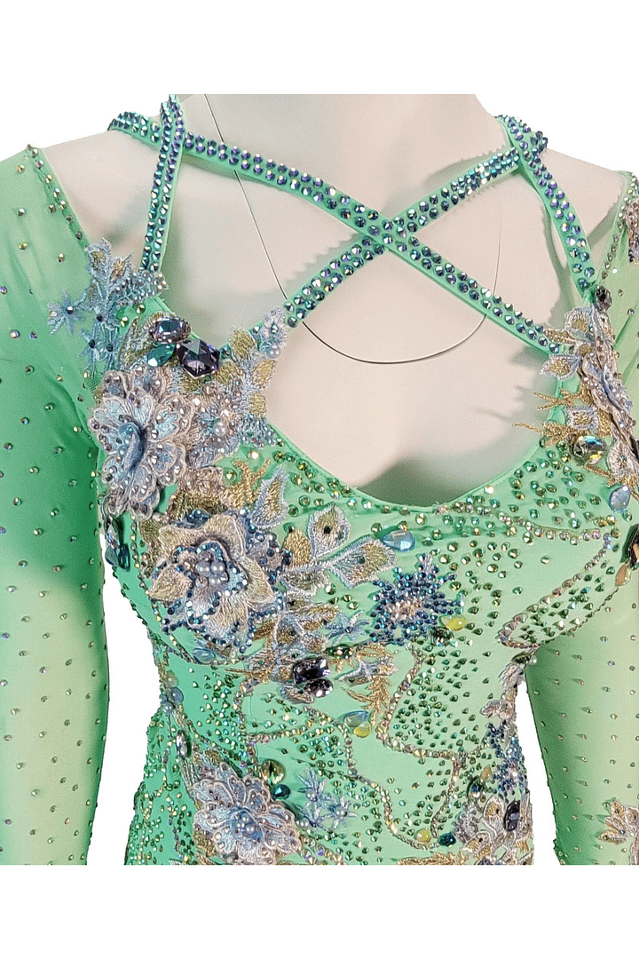 Rain ballroom dress — bodice detail — close-up of the pastel green bodice, showing delicate embroidered flowers in lavender and blue, surrounded by abundant stoning and gold thread.