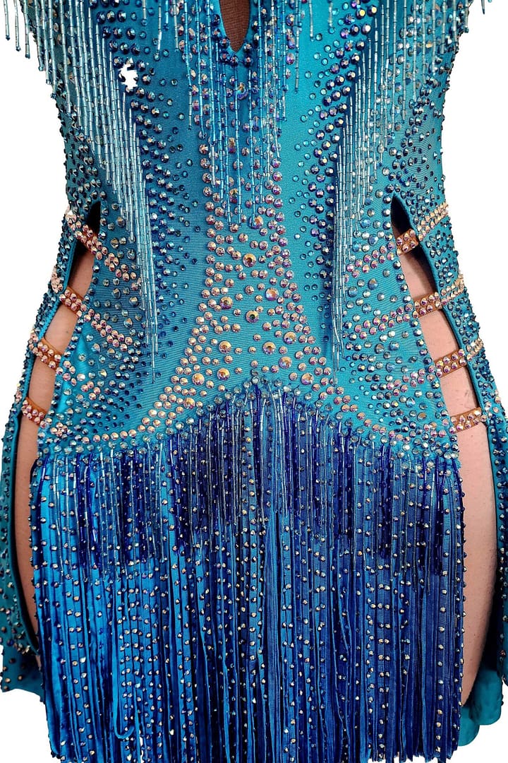 Carla Latin dress — bodice detail - close-up of waist and hip cutouts with strappy accents and dense blue crystal stoning.