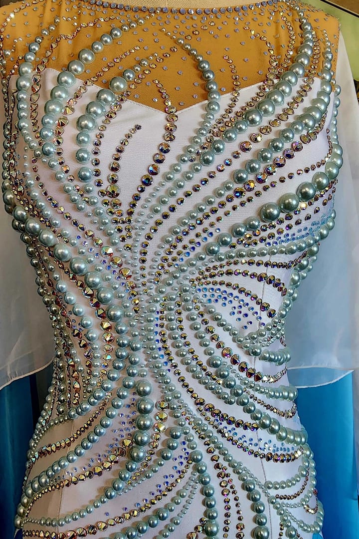 Cyra ballroom dress - Bodice Detail - Aqua pearls and AB crystals in a swirl pattern detail.