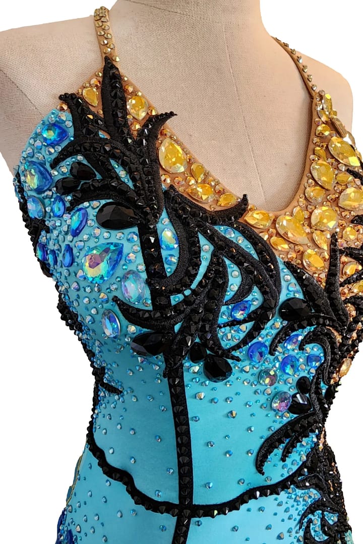 Jayla Latin dress — stonework close-up — aqua and clear AB crystals with black velvet appliqué on the turquoise side.
