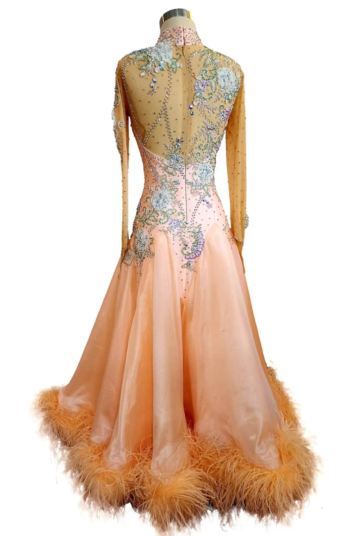 Peach ballroom gown — hem detail — flowing peach skirt with a dramatic trim of soft, matching peach-colored ostrich feathers.