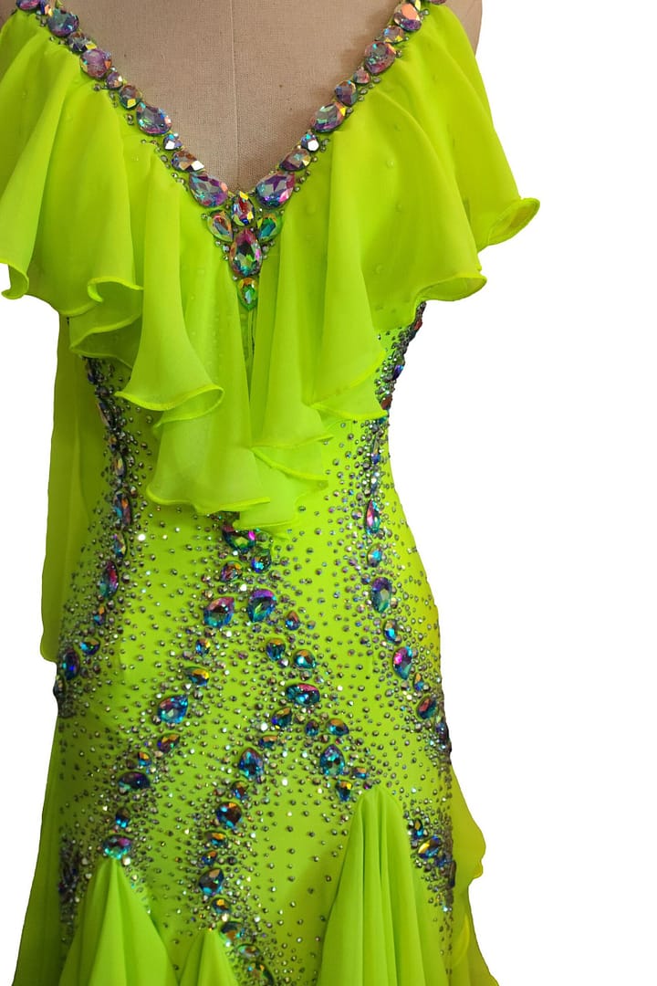 Close-up detail of rhinestones and iridescent crystals on Electric Citrine ballroom gown bodice