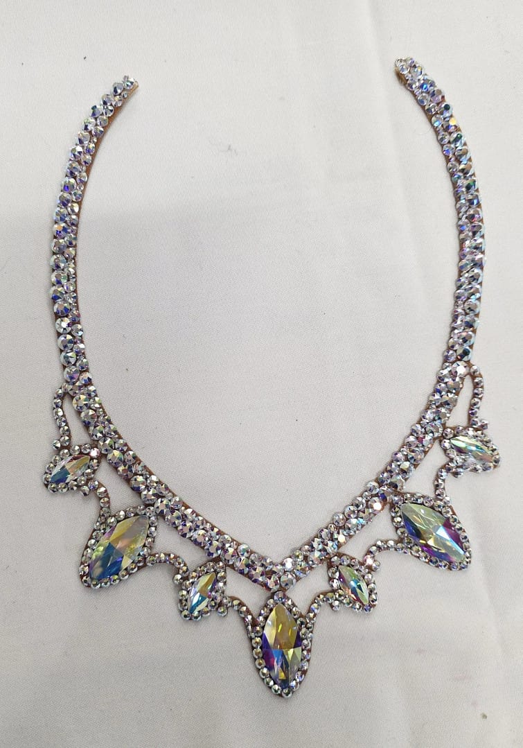 Full flat lay of crystal ballroom necklace showing balanced stone arrangement